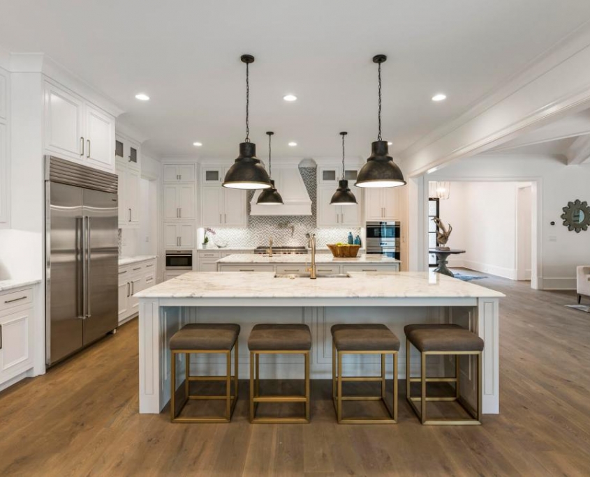 Spacious and Elegant White Twin Islands Kitchen